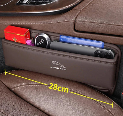 Caja de almacenamiento de ranura para asiento de Jaguar